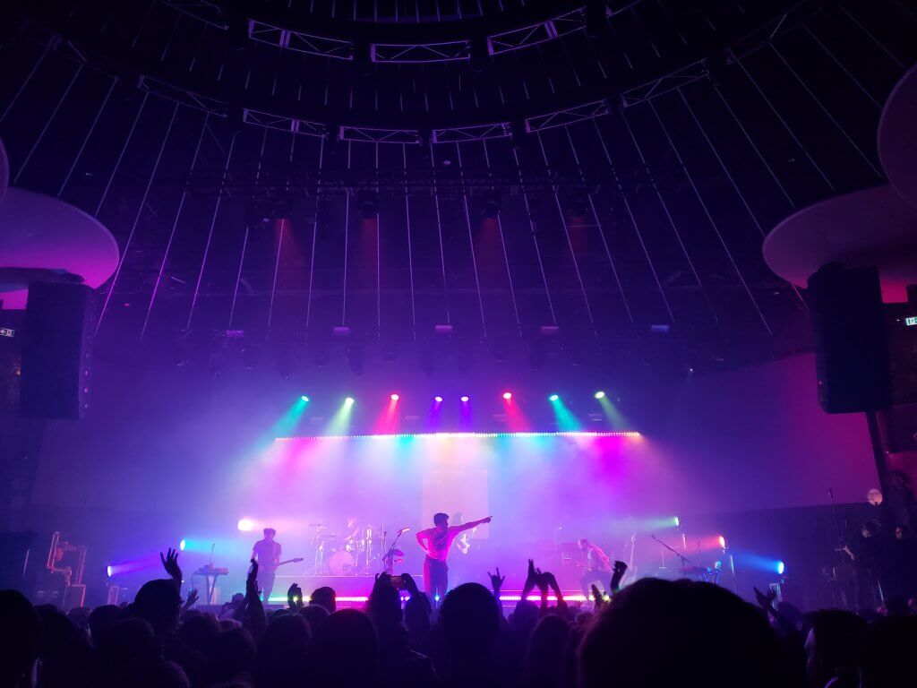 Image of Young The Giant performing at their concert.
