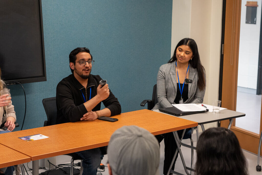 Student presenting at a panel event.
